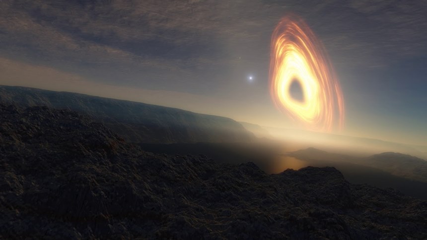 블랙홀 주변을 맴도는 행성에서 바라본 하늘의 풍경을 그린 상상도. 거대한 블랙홀이 뜨고 지는 풍경은 어떤 느낌일까? 이미지=Space Engine